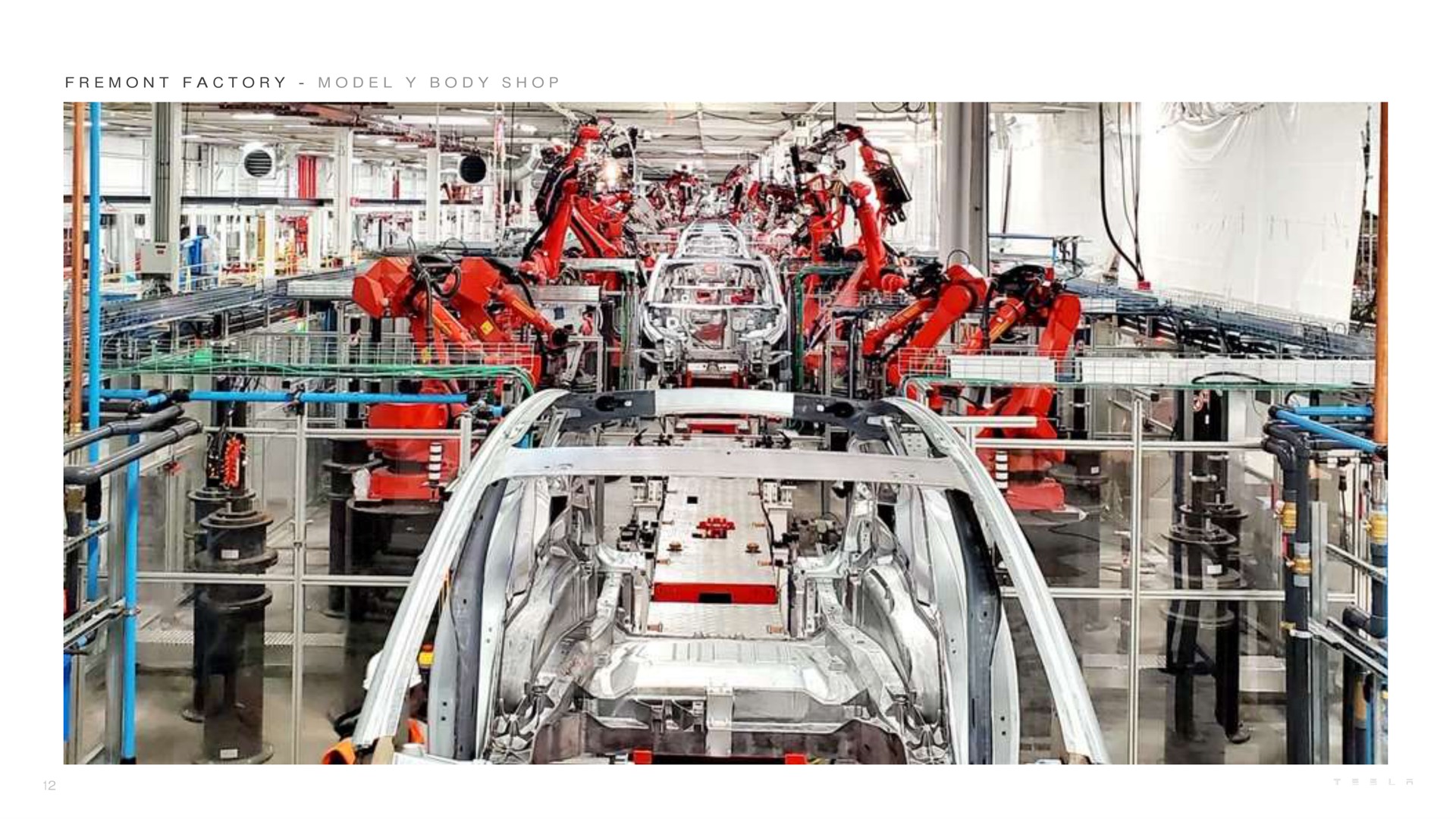 a factory model body shop | Tesla